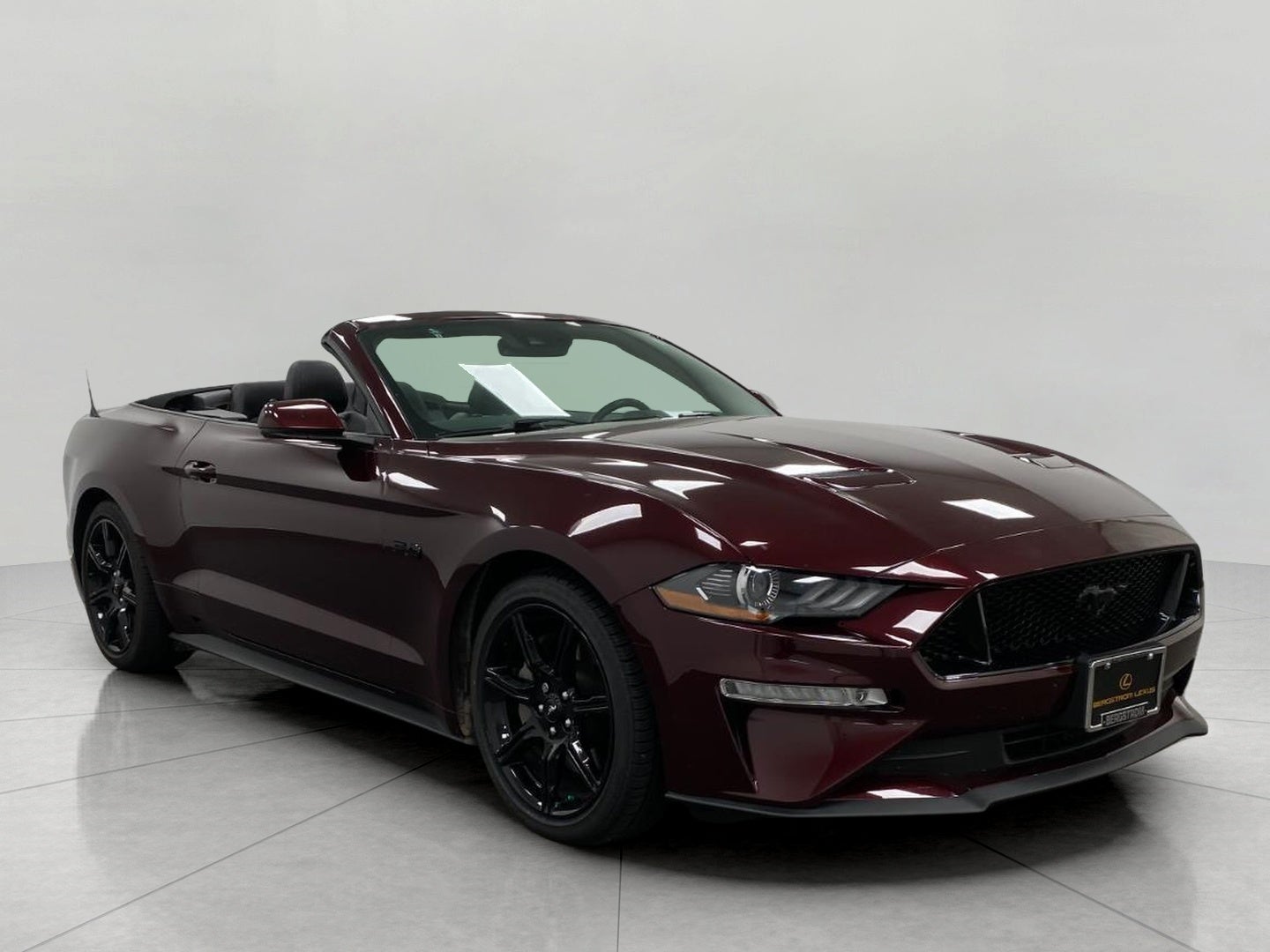 2018 Ford Mustang GT Premium Convertible in Royal Crimson Metallic Tinted Clearcoat — front three-quarter view