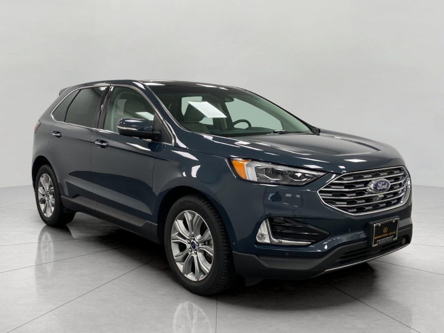 2019 Ford Edge Titanium AWD in Baltic Sea Green Metallic — front three-quarter view